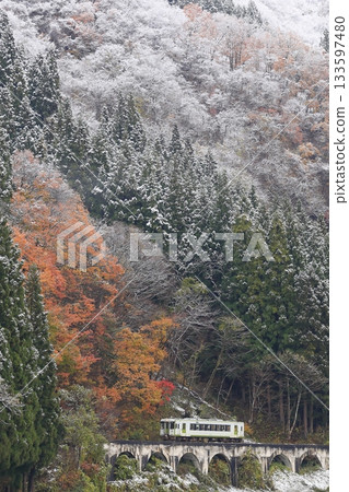 Tadami Line of autumn leaves and snow scene Tadami Line of autumn leaves and snow scene 133597480