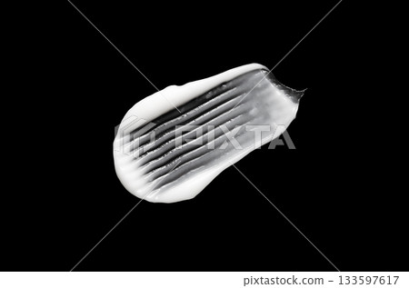 A sample of white body cosmetics on a black background 133597617