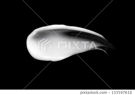 A sample of white body cosmetics on a black background 133597618