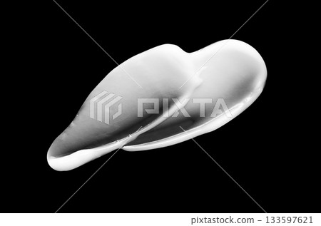 A sample of white body cosmetics on a black background A sample of white body cosmetics on a black background 133597621