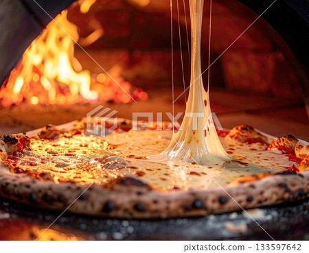 Hot wood-fired pizza and melted cheese: a sizzling close-up 133597642