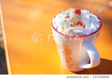 Cute chocolate snowmen in hot cocoa - a warm winter treat 133598689