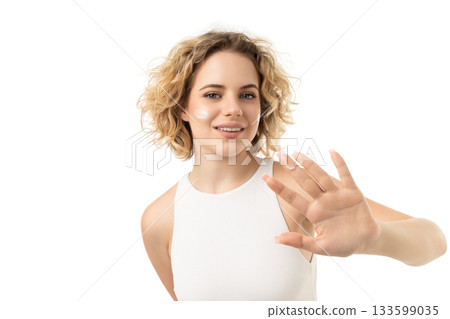 Woman uses facial care on clean skin, isolated on white, PNG Woman uses facial care on clean skin, isolated on white, PNG 133599035