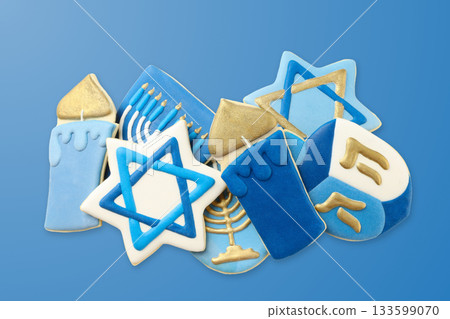Different Hanukkah-themed cookies on a blue background 133599070