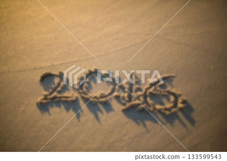 High angle view of number 2016 on sand High angle view of number 2016 on sand 133599543
