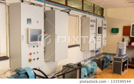 Wall-mounted control cabinet is powering electric motors in flat design equipment room with windows 133599544