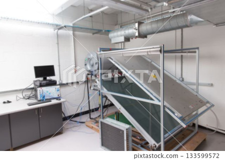 Large wheeled test apparatus is standing in flat design lab, with angled panel and network cables Large wheeled test apparatus is standing in flat design lab, with angled panel and network cables 133599572