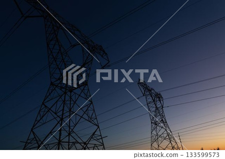 The evening electricity pylon silhouette The evening electricity pylon silhouette 133599573