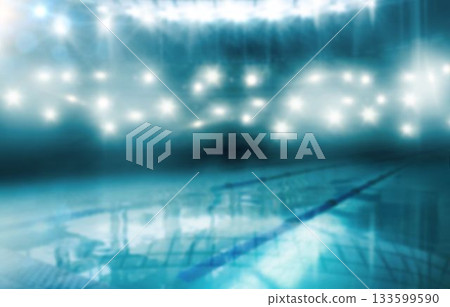 Featuring empty tiled pool with floating lane dividers, reflecting stadium lights and shining water Featuring empty tiled pool with floating lane dividers, reflecting stadium lights and shining water 133599590