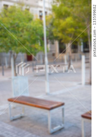 Defocused image of empty bench at park Defocused image of empty bench at park 133599682