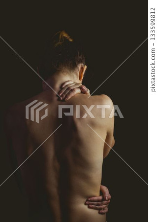 Single woman is placing hand on neck and highlighting spine in flat design with dark backdrop Single woman is placing hand on neck and highlighting spine in flat design with dark backdrop 133599812