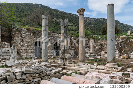 Corinthian column and ancient Roman ruins at Ephesus archaeological site, Selcuk, Turkey. Corinthian column and ancient Roman ruins at Ephesus archaeological site, Selcuk, Turkey. 133600209