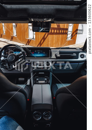 Luxury vehicle interior showcases modern design and technology on a sunny day Luxury vehicle interior showcases modern design and technology on a sunny day 133600622