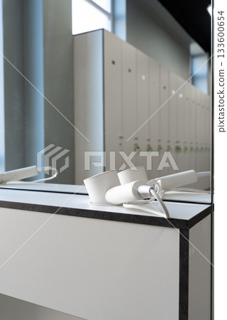 Lockers and equipment in a modern gym setting with a clean and bright atmosphere Lockers and equipment in a modern gym setting with a clean and bright atmosphere 133600654