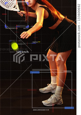 Tennis player prepares to hit a fast-moving ball during a match 133600692