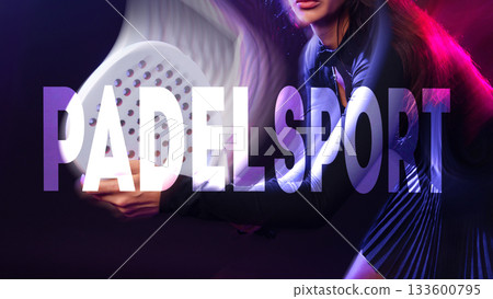 Padel sport player focused on action during a dramatic match at night 133600795