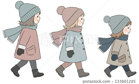 Three children in winter clothes walking 133601285