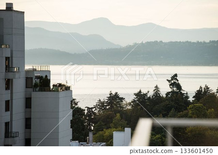 Scenic view of sea by silhouette mountains Scenic view of sea by silhouette mountains 133601450