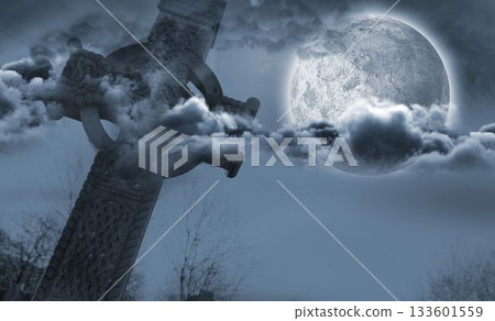 Celtic cross in front of moon behind clouds 133601559
