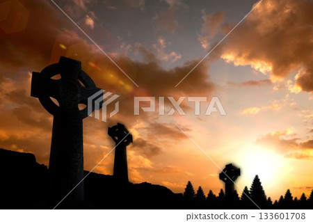 Celtic cross religion symbol shape over sunset sky 133601708