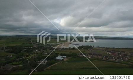 Houses by beach against cloudy sky in town Houses by beach against cloudy sky in town 133601758