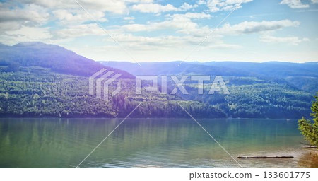 Scenic view of river and mountains against sky Scenic view of river and mountains against sky 133601775