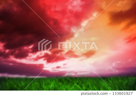 Grassy field against cloudy sky Grassy field against cloudy sky 133601927