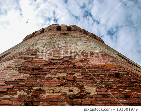 The top of the fortress watchtower with battlements and loopholes. 133601979