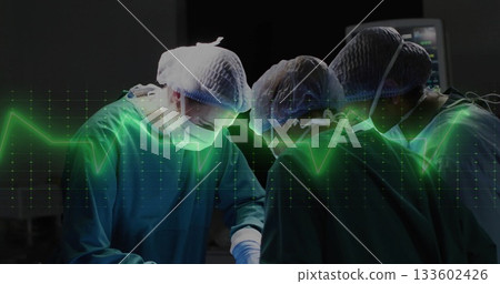 Performing surgery three surgeons wearing gowns leaning over patient in OR, with ECG waveform 133602426