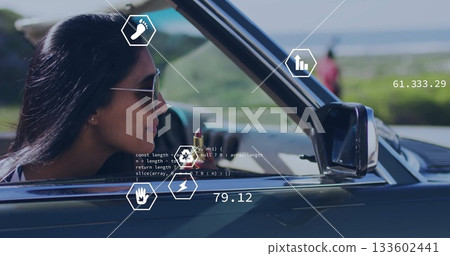Driving woman wearing aviator sunglasses cruising convertible on coastal road, AR icons, copy space 133602441