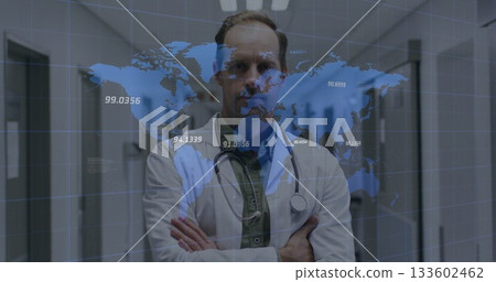 Male doctor wearing white coat, stethoscope crossing arms in hospital corridor, digital map overlay 133602462