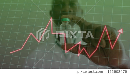 Presenting medical professional in lab coat and mask holding COVID-19 vial in lab with grid overlay 133602476