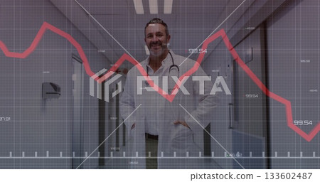 Standing doctor wearing white lab coat and stethoscope in hospital corridor, with red chart overlay Standing doctor wearing white lab coat and stethoscope in hospital corridor, with red chart overlay 133602487
