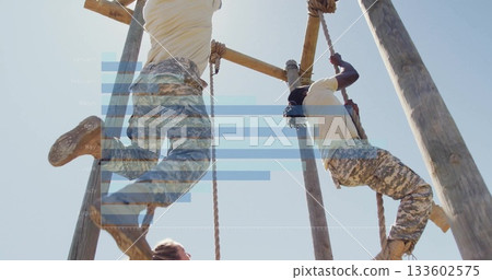 Climbing trainees in camouflage pants and boots ascending ropes on obstacle course, wooden beams Climbing trainees in camouflage pants and boots ascending ropes on obstacle course, wooden beams 133602575