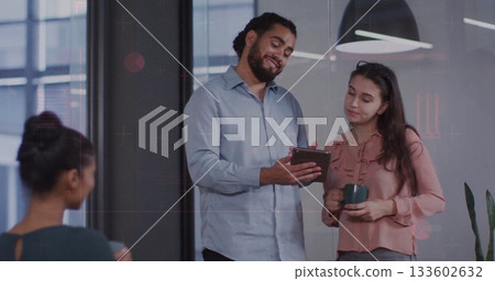 Discussing office coworkers reviewing project details in modern office space, with tablet and mugs Discussing office coworkers reviewing project details in modern office space, with tablet and mugs 133602632