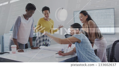Four colleagues reviewing blueprints in meeting room, with pens markers notebook and coffee cup 133602637