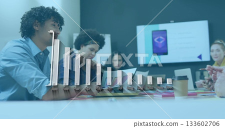 Reviewing team members discussing design at office meeting room, with documents and monitor slide 133602706