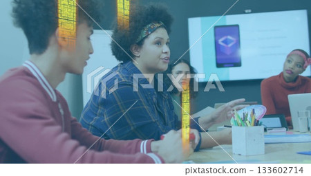 Gesturing woman wearing blue plaid shirt leading discussion in conference room, with display screen Gesturing woman wearing blue plaid shirt leading discussion in conference room, with display screen 133602714