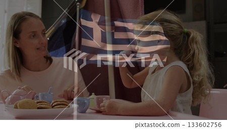 Pretending mother and daughter pouring tea in dining area, pink table, toy teapot and Greek flag Pretending mother and daughter pouring tea in dining area, pink table, toy teapot and Greek flag 133602756