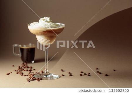 Black coffee and iced coffee cocktail on a beige background. 133602890