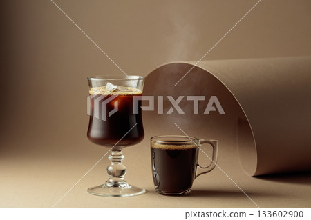 Espresso and black coffee with ice on a beige background. Espresso and black coffee with ice on a beige background. 133602900