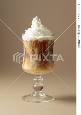 Cream and coffee cocktail on beige background. 133602903