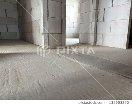 New building. Concrete floor and gray block walls New building. Concrete floor and gray block walls 133603250