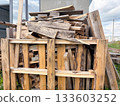 a large pile of wooden construction waste at a construction site 133603252