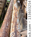 metal pipes are covered with brown corrosion and rust 133603254