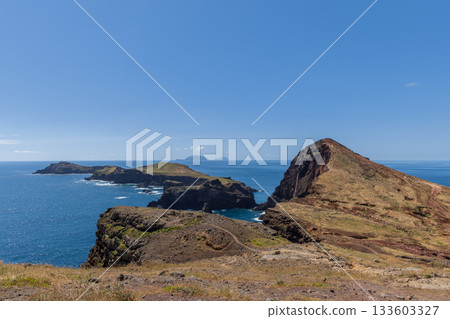 Ponta de Sao Lourenco on Madeira juts into Atlantic with cliffs coves and dry grassy hills Ponta de Sao Lourenco on Madeira juts into Atlantic with cliffs coves and dry grassy hills 133603327