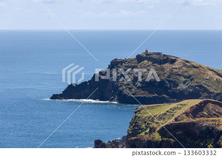 Sunlit Sao Lourenco lighthouse on Madeira above cliffs with clear view of Atlantic Ocean Sunlit Sao Lourenco lighthouse on Madeira above cliffs with clear view of Atlantic Ocean 133603332