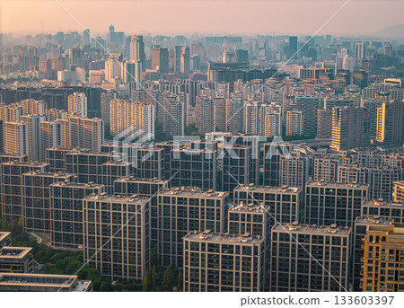 Many residential apartment buildings fill the skyline of an urban city in China during the daytime 133603397