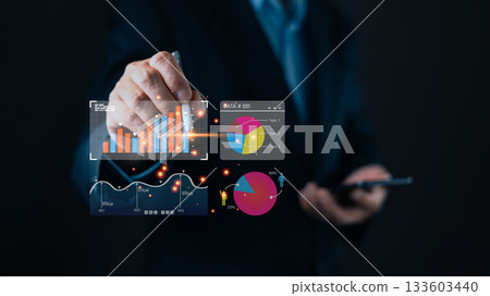 A business professional interacts with a digital interface displaying charts, graphs, and data visualizations, symbolizing digital insights, marketing strategies, and dashboard tools for the analyst. 133603440