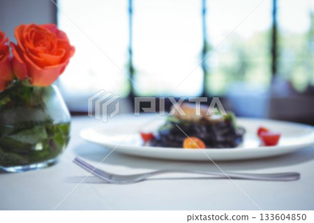 Lam chop in plate and roses on table Lam chop in plate and roses on table 133604850